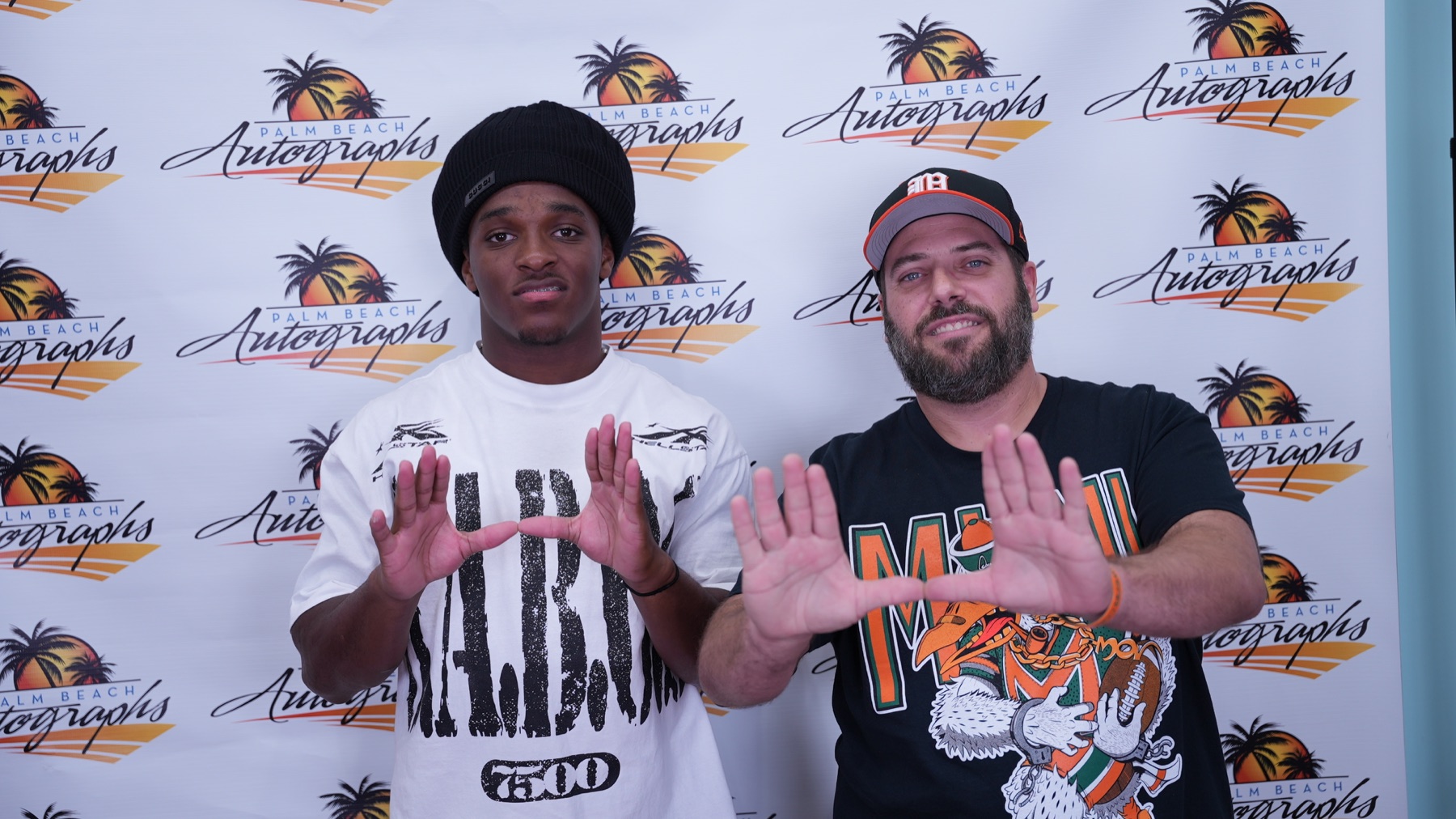OLI SPORTCARDZ pictured with football player Malachi Toney